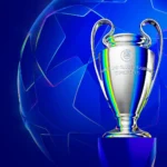UEFA Champions League referee officiating a qualifying match