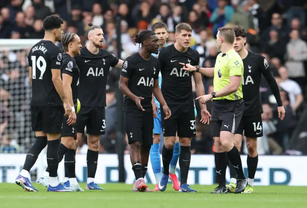 Raul Jiménez makes contact with two hands on Radu Drăgușin before Fulham’s opener