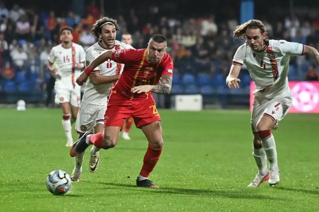 Referee reviews a VAR decision during a Nations League football match